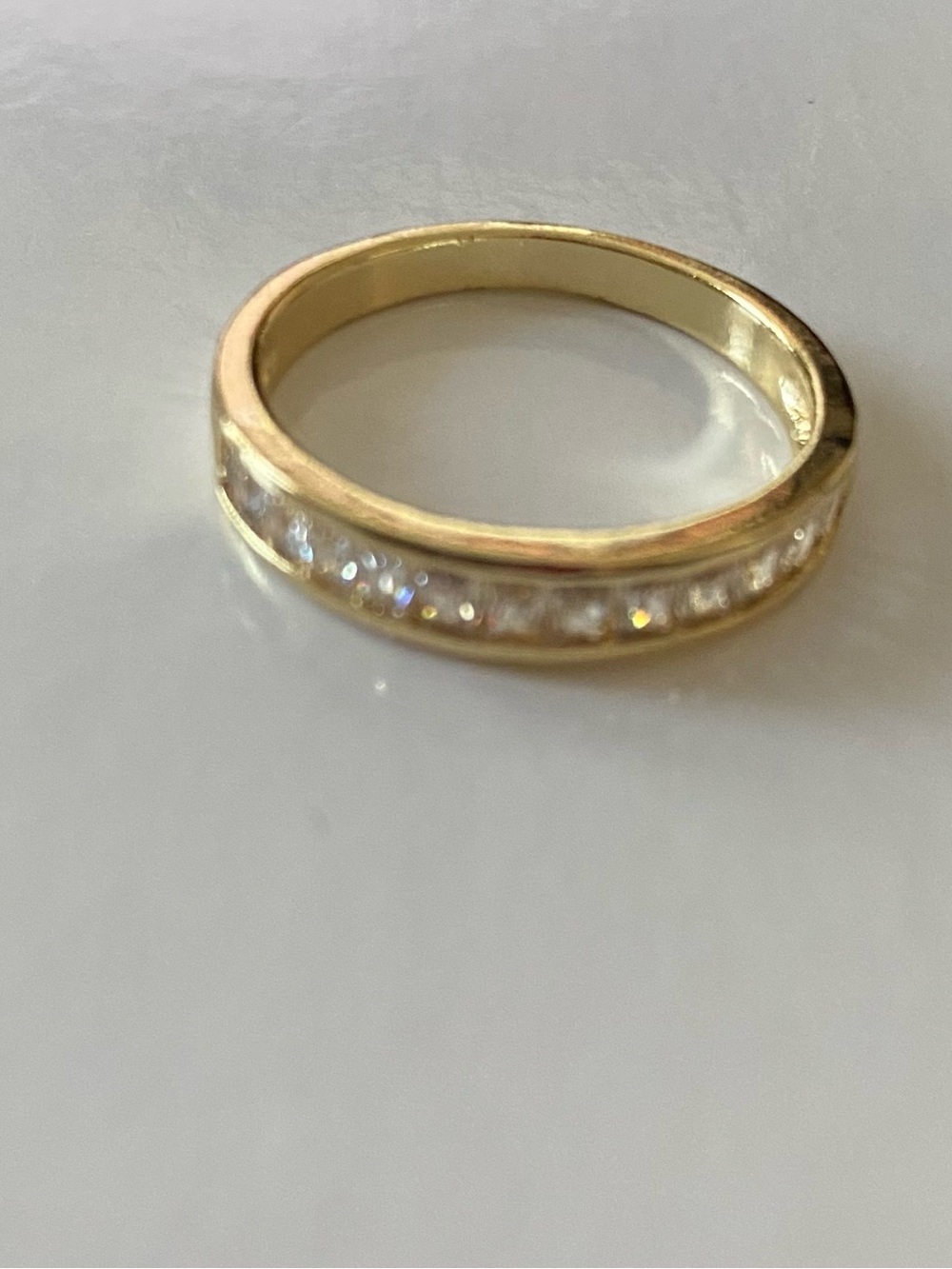 Classic Gold Band Ring with Channel-Set Clear Stones